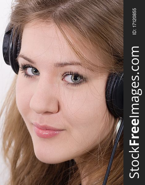 Young attractive woman in big closed DJ stereo headset. Young attractive woman in big closed DJ stereo headset