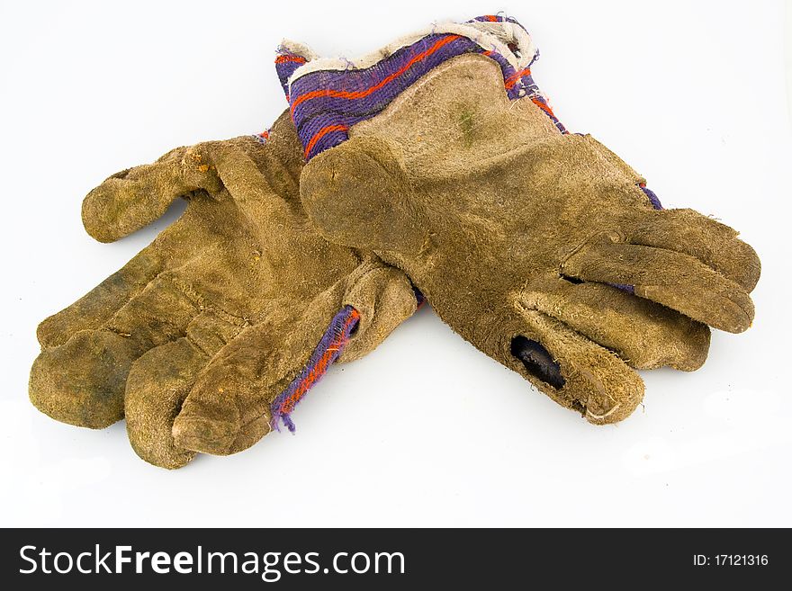 Old work gloves isolated on white