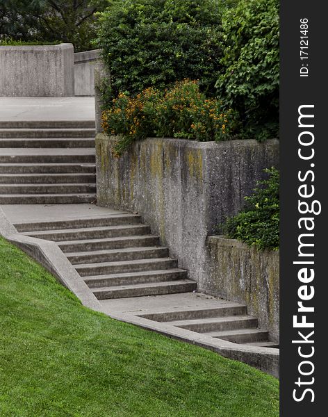 A set of winding cement stair steps in a large city. A set of winding cement stair steps in a large city.