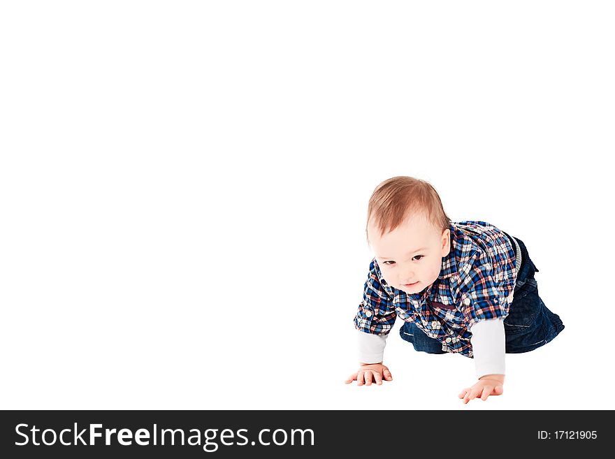 Six month old baby boy proud and happy crawling. Copy space left. Six month old baby boy proud and happy crawling. Copy space left.