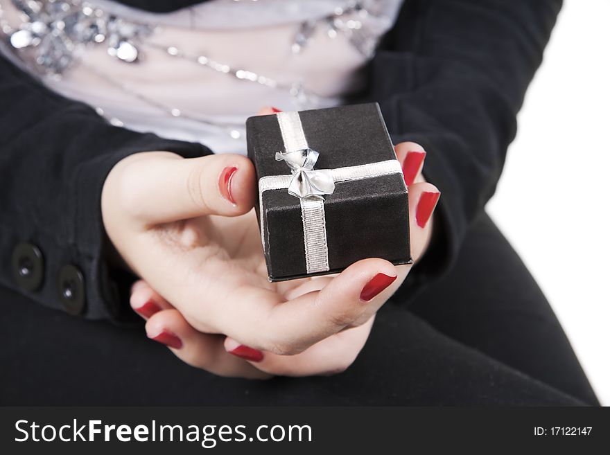 Lady's hands with gift on white background. Lady's hands with gift on white background