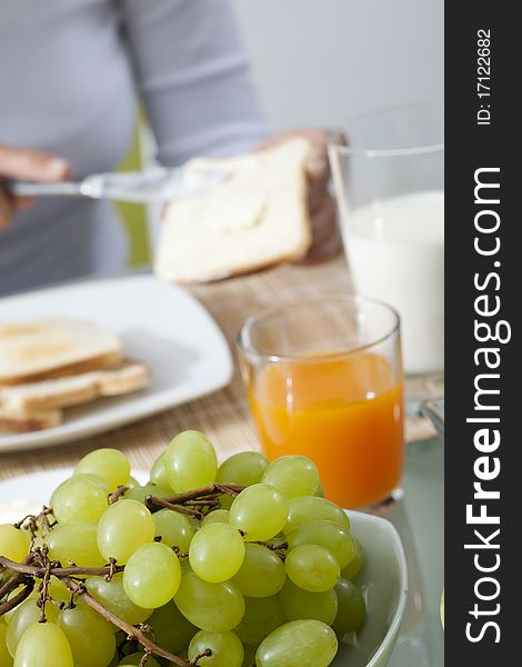 Woman doing breakfast in a kitchen. Woman doing breakfast in a kitchen