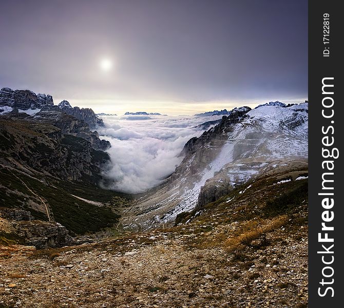 Stitched Panorama, Mountains over the fog in the autumn sunrise, Dolomity, Italy