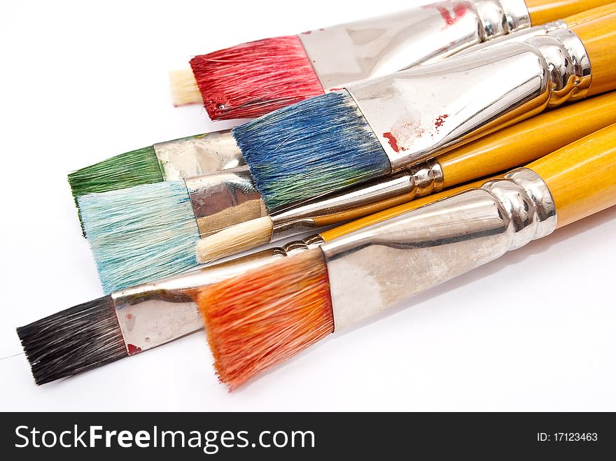 Paint brushes on white background