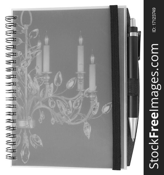 Spiral notebook with pen isolated on white