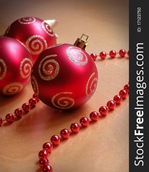 Red present against red background and christmas deco. Red present against red background and christmas deco