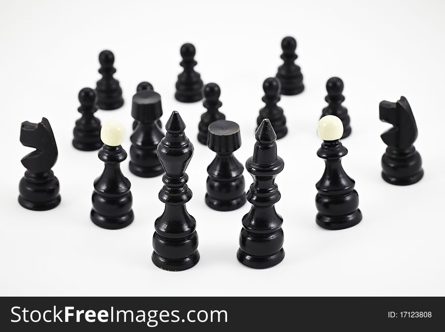 Chess game black figurines on a white background. Chess game black figurines on a white background