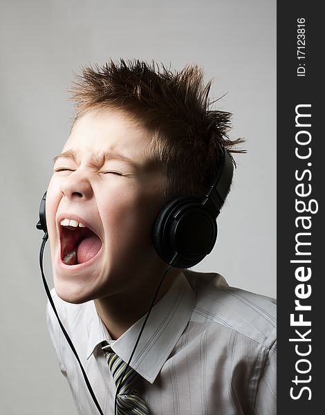 Ten year young child screaming with angry face expression isolated on white. Ten year young child screaming with angry face expression isolated on white