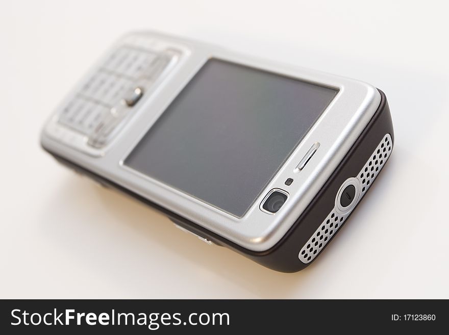 Close-up of silver mobile phone isolated on white background.