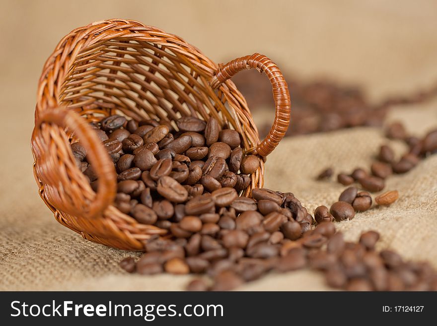 Fragrant fried coffee beans on the little basket