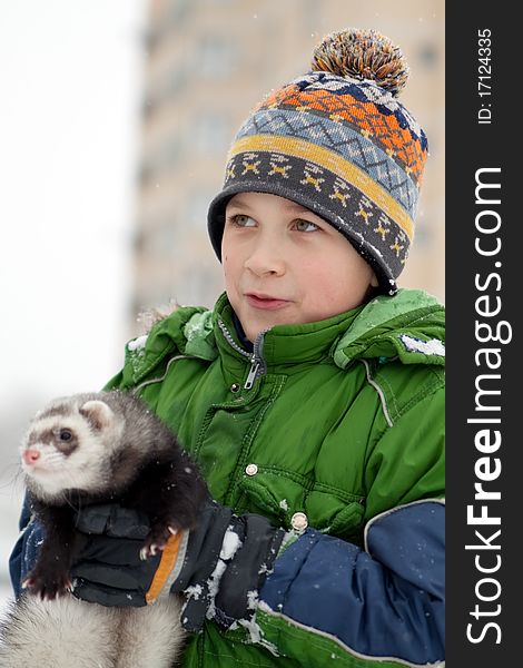 The Boy Holds A Polecat