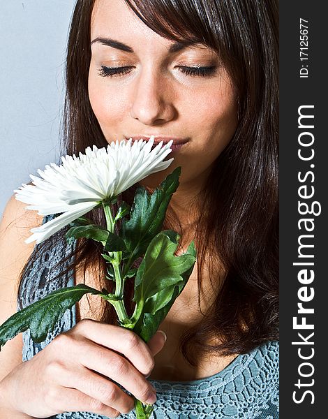 Young woman with flowers in her hand