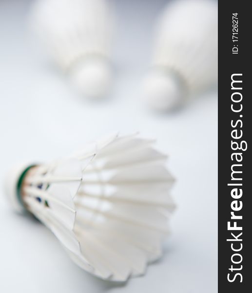 Badminton shuttlecocks on white
 (color toned image)