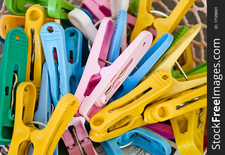 Colorful of plastic clamp in busket. Colorful of plastic clamp in busket