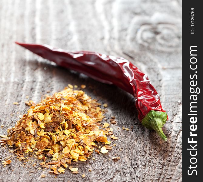 Chili seeds and pod on wooden table. Chili seeds and pod on wooden table