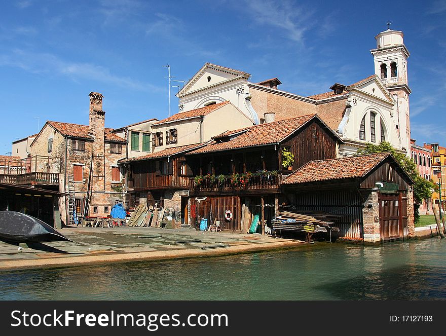 View of the old building with gondolas in the centre of Venice . View of the old building with gondolas in the centre of Venice .