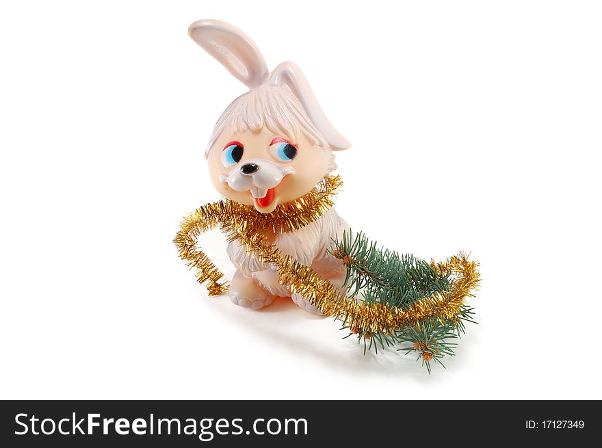 The rabbit with a fur-tree branch is isolated on a white background