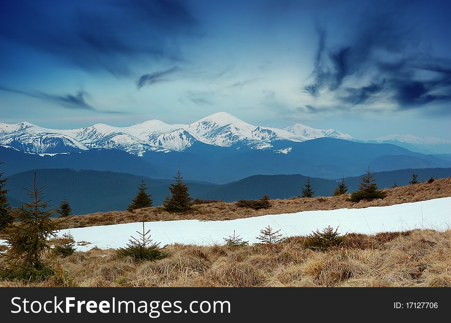 Spring landscape in mountains with snow tops. Ukraine, mountains Carpathians.