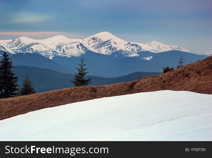 Spring landscape in mountains with snow tops. Ukraine, mountains Carpathians.