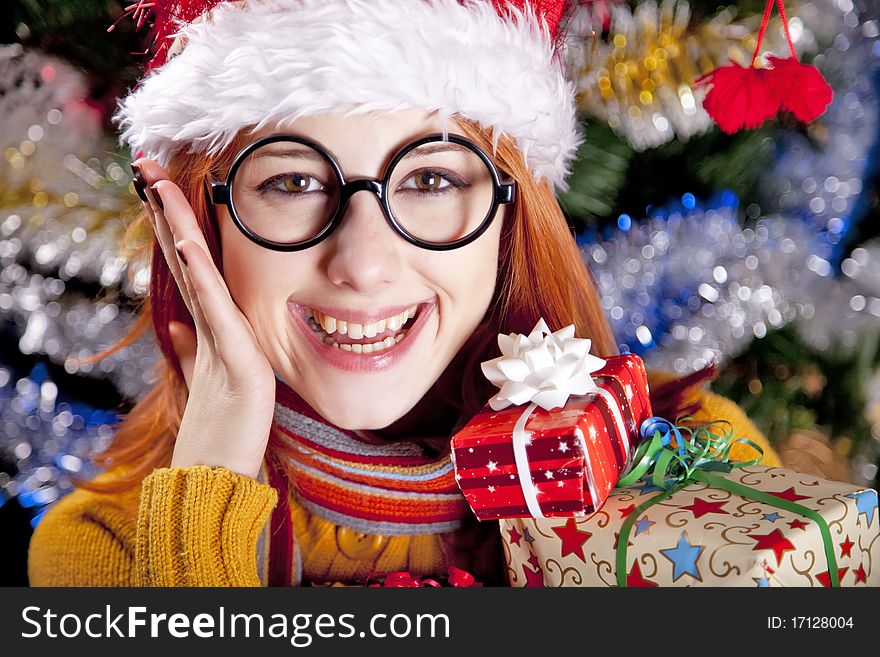 Funny Girl In Christmas Cap With Gift Boxes