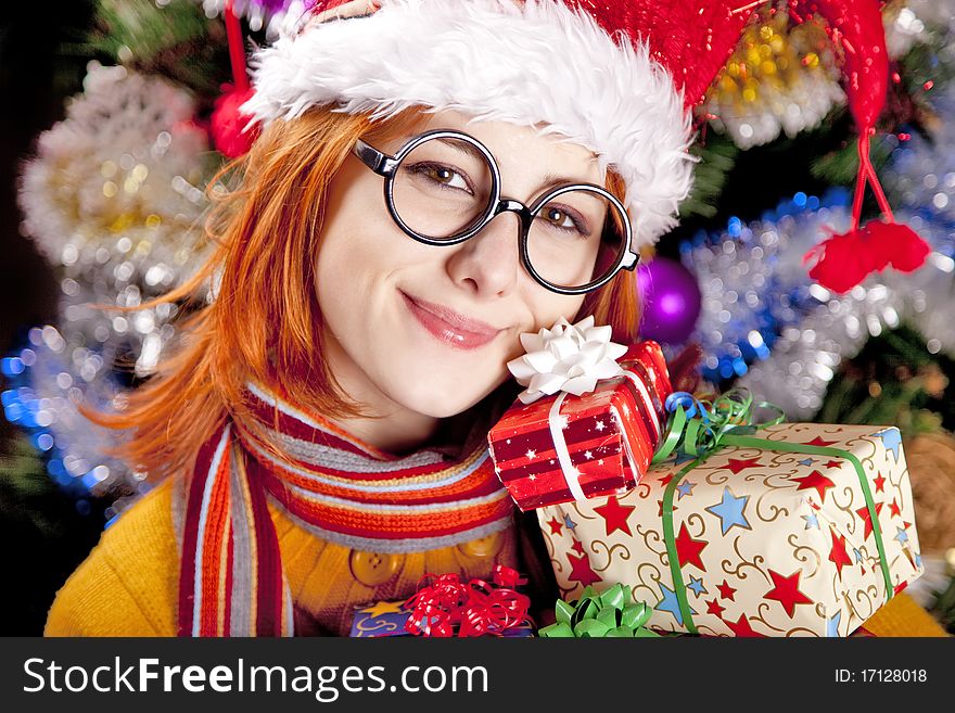 Funny Girl In Christmas Cap With Gift Boxes