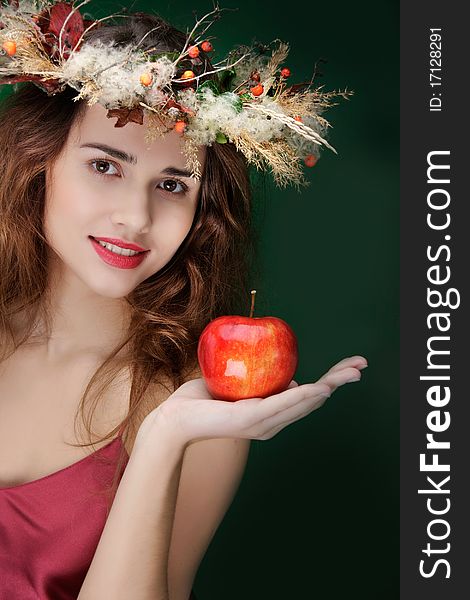 Girl In Natural Wreath With Apple