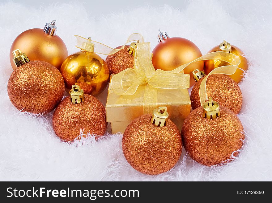 Christmas brightly spheres on the white fur