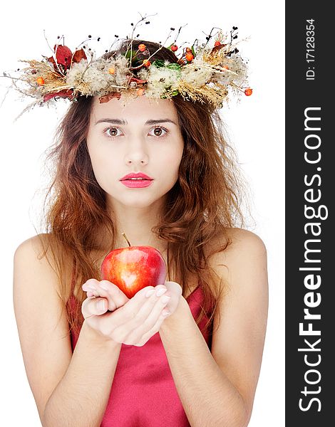 Young beautiful woman with apple over white. Young beautiful woman with apple over white