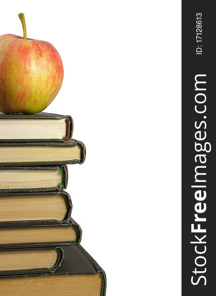 Books and apple on white background