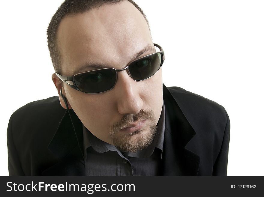 Caucasian Man In A Black Suit And Sunglasses