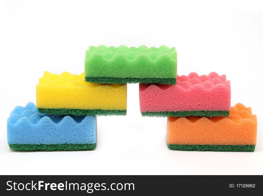 Group of bright-colored sponges for cleaning and home care - isolated on white background. Group of bright-colored sponges for cleaning and home care - isolated on white background