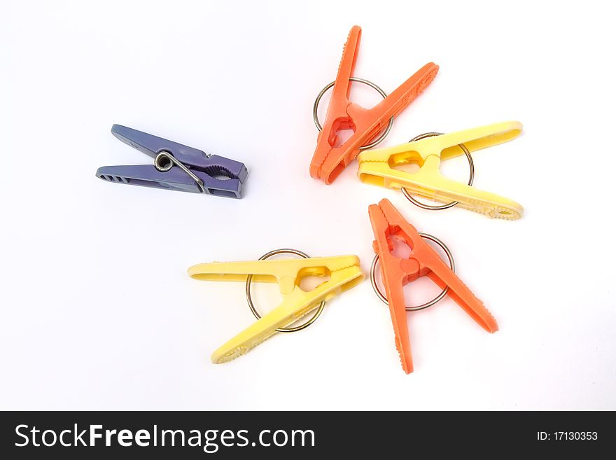 Five colorful clothespins isolated on white background