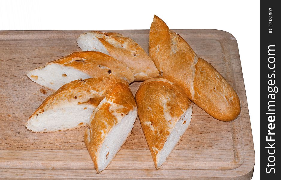 Pieces of onion baguette on a wooden cutting board. Pieces of onion baguette on a wooden cutting board