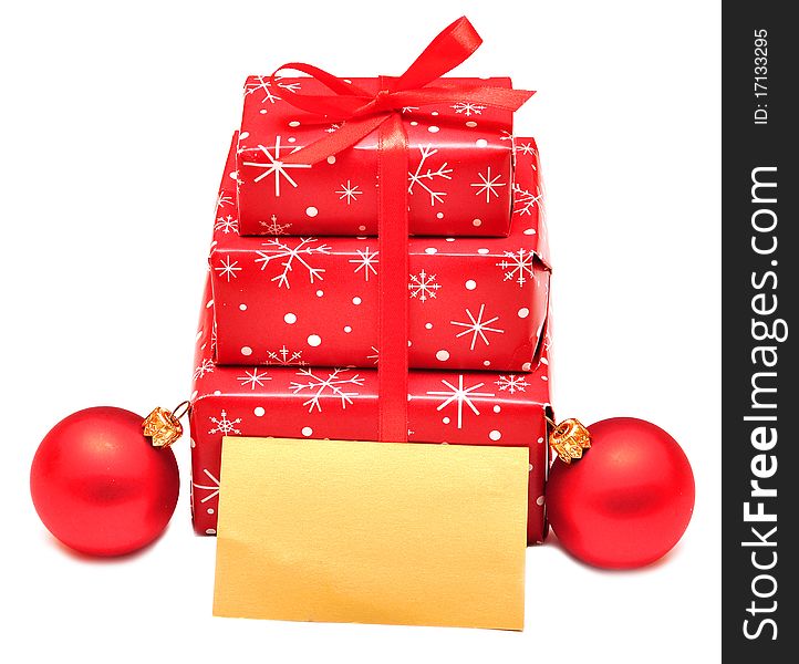 Gift boxes with red balls and card for greeting. Gift boxes with red balls and card for greeting
