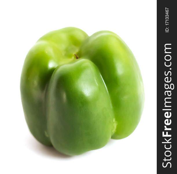 Green pepper upside-down on white background. Green pepper upside-down on white background