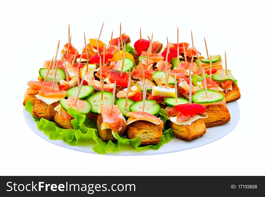 Canape on a dish on a white background. Canape on a dish on a white background