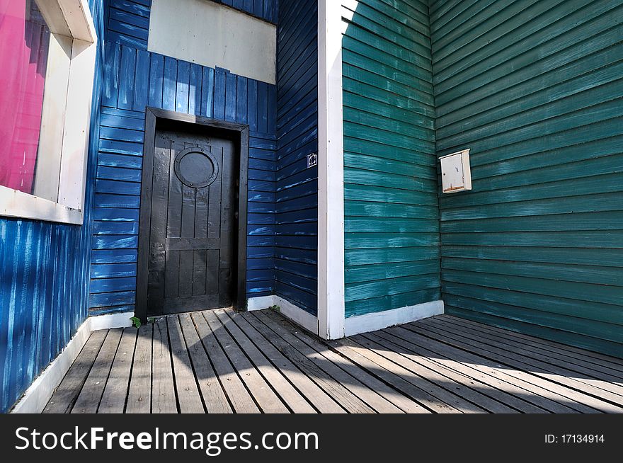 Wooden architecture in blue and green, shown as harmonious color, geometric composition, and wide view angle perspective. Wooden architecture in blue and green, shown as harmonious color, geometric composition, and wide view angle perspective.