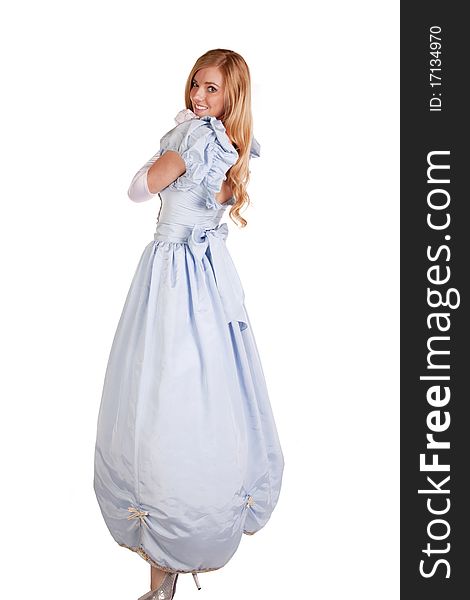 A woman in her beautiful blue princess dress looking over her shoulder with a smile on her face. A woman in her beautiful blue princess dress looking over her shoulder with a smile on her face.