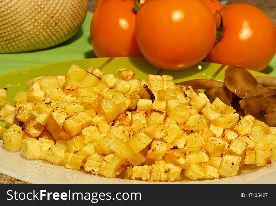 Fried potatoes into small cubes on a plate