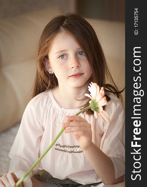 Pretty caucasian girl hold a flower in her hands. Pretty caucasian girl hold a flower in her hands