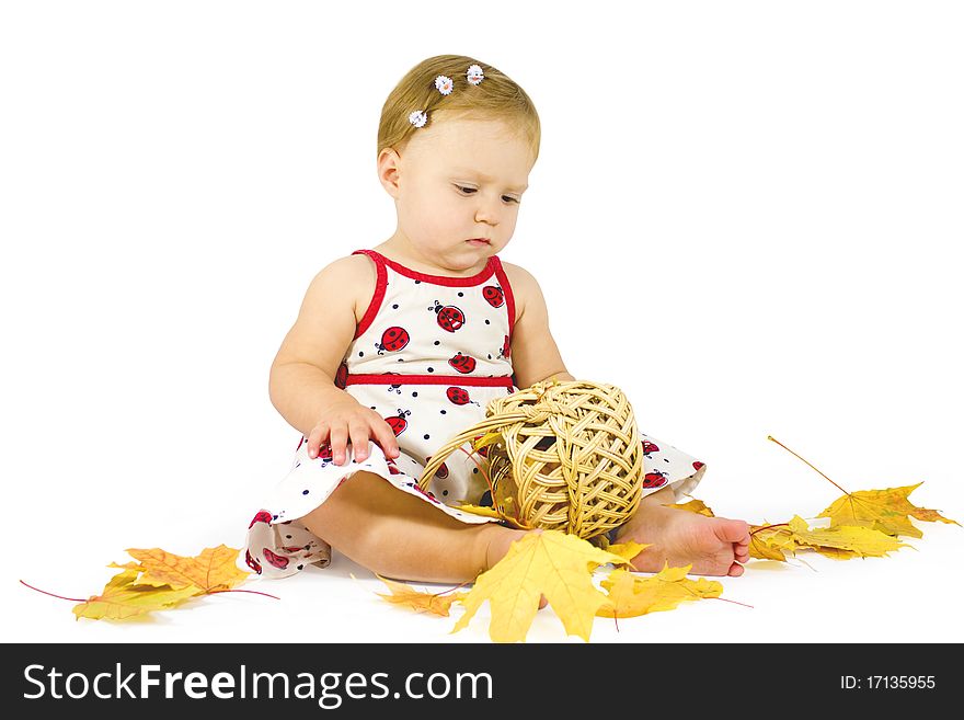 Little girl playing with leaves