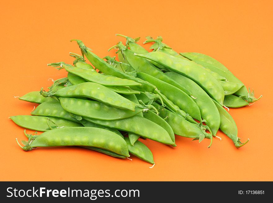 Snow peas isolated on Orange background