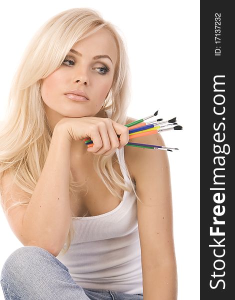 Very beautiful blonde with a bunch of colored pencils on white background. Very beautiful blonde with a bunch of colored pencils on white background