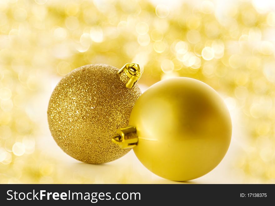 Christmas balls on blurred golden background. Christmas balls on blurred golden background
