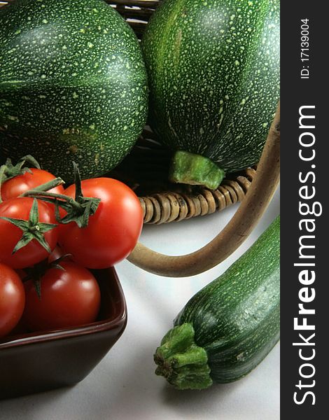 Basket Of Tomatoes And Organic Zucchinis