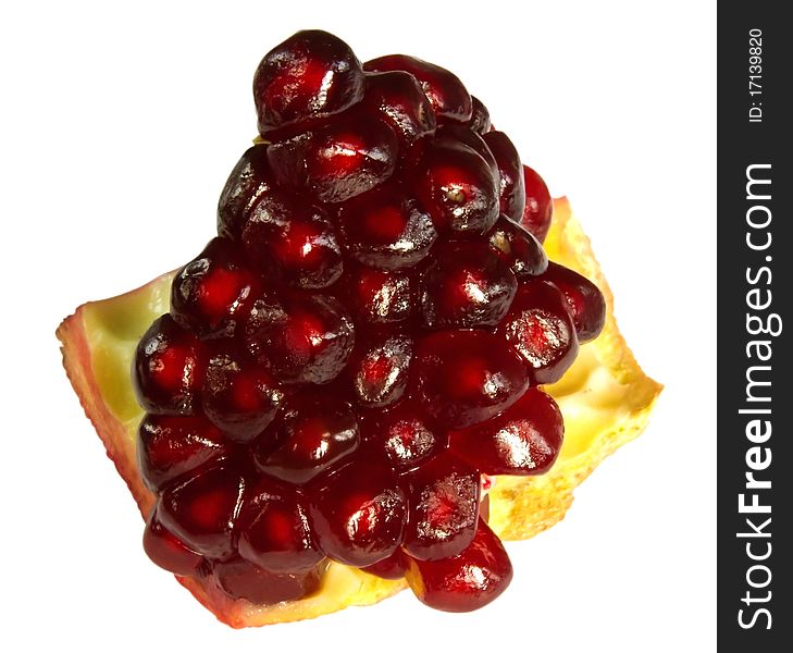 Piece of pomegranate isolated over white background. Clipping path. Piece of pomegranate isolated over white background. Clipping path.