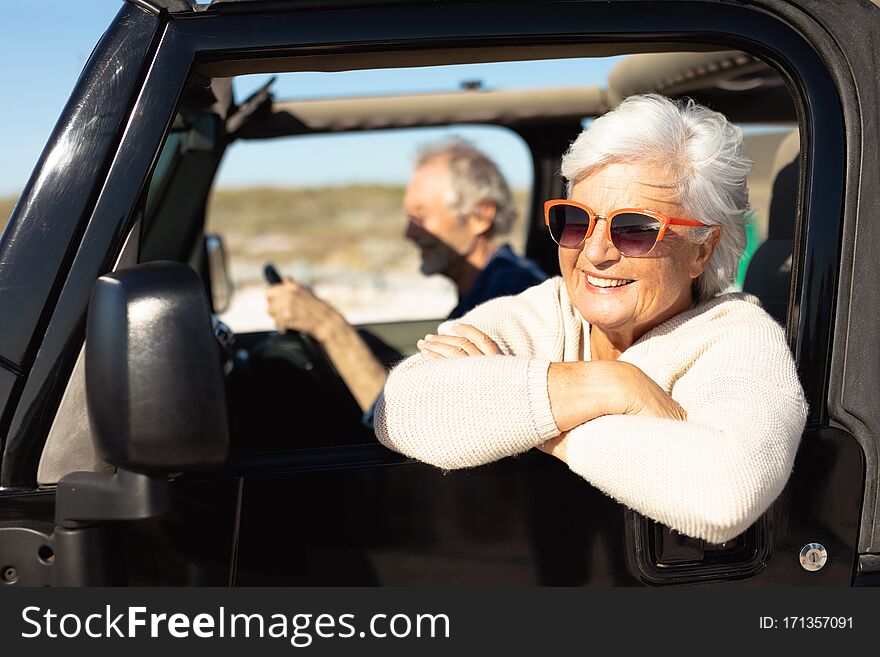 Old Couple With A Car At The Beach