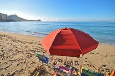 Red Umbrella In Beach With Chairs By Ocean Stock Image