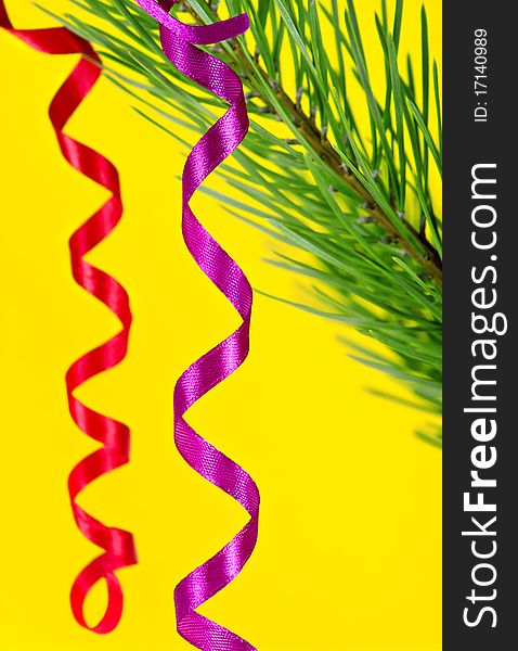 Christmas ribbons on yellow background