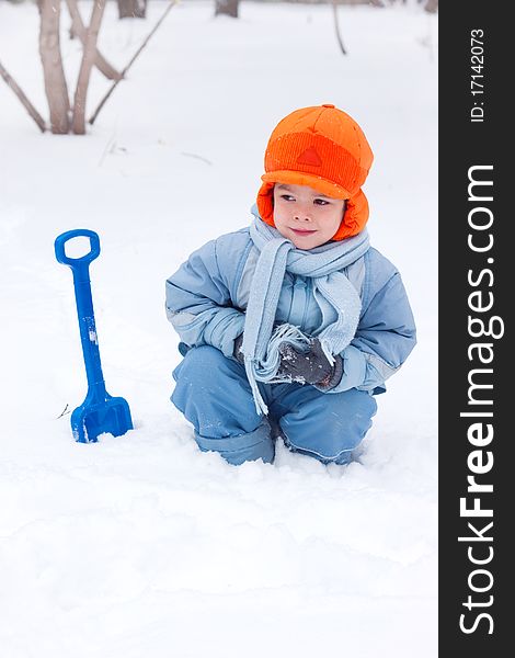 Little Boy Playing, Digs Snow